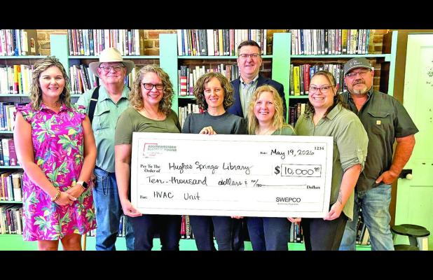 Hughes Springs Library staff receive check from SWEPCO for much needed A/C Unit Courtesy photo