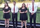 Four of the eight honor students who escorted graduating seniors down the stairs and onto the field.