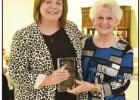HSISD Superintendent Sarah Dildine, left, accepts the Crystal Globe award for Citizen of the Year on behalf of the Hughes Springs School District. Secretary Nita Clark presented the award. BEE PHOTOS / TONI WALKER Hughes Springs honors those who helped make the community “Stronger Together” in 2020