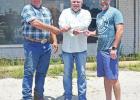 Marty Walker, center, congratulates Mike Rogers (left) and Steven Green on the pairs’ transfer of ownership of the old Jones Shopping Center. BEE PHOTO / TONI WALKER Changes coming soon