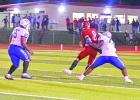 Marlon Hayes (77) Of the Daingerfield Tigers sacks the Harmony quarterback for a loss during Daingerfield’s win over the Eagles. Tigers earn thirty-ninth district title in undefeated style