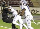 FINDING SOME ROOM TO RUN -- Daingerfield quarterback Chase Johnson (0) runs off the block by tailback Ashton Williams (1) on this first half play on Friday night in Palestine. The dynamic duo of Johnson and Williams ran the ball 28 times for a negative 15 FINDING SOME ROOM TO RUN -- Daingerfield quarterback Chase Johnson (0) runs off the block by tailback Ashton Williams (1) on this first half play on Friday night in Palestine. The dynamic duo of Johnson and Williams ran the ball 28 times for a negative 15