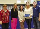 Judi Howell, far left, and Josh Sanders, far right, present the Chamber’s Community Pride Award to Shawn Freemand and Stephanie Chambers in recognition of the Daingerifeld High School Tiger Belles. BEE PHOTO / TONI WALKER Chamber honors award recipients with annual awards banquet