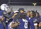 The Daingerfield Tigers celebrate with Coach Davin Nelson following their 42-21 win over Newton in the Region III finals Friday in Jacksonville. The Tigers (11-3) advance to the state semifinals where they will take on Tidehaven (13-0) at 7 p.m. Thursday For the city: Daingerfield advances to state semis after 42-21 win over Newton