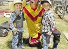 Cousins Tye Teeter (left) and Luke Adams (right) are pictured with rodeo clown John Harrison, who was the 2022 PRCA Clown Barrell man of the year. Harrison recognized Tye, 4, and Luke, 6, for competing in the mutton-busting competition at this past weeken Mutton-bustin’ cousins