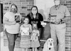 COURTESY PHOTO CASA accepts donation from Jingle Bell Jog