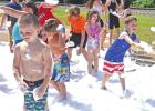 Children of all ages enjoyed splashing in the foam and water from the Hughes Springs Volunteer Fire Department, as the group opened the Hughes Springs Library Summer events June 10. BEE PHOTOS / TONI WALKER Back with a Splash!