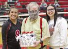 Hughes Springs volleyball recognized “super fan” John Jones during Tuesday’s game against New Diana, thanking him for his support of the program with a gift basket. BEE PHOTO / QUINTEN BOYD True friend of the program