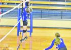 Two Lady Tiger JV players go up for a block against Redwater in recent action. The Daingerfield squads fell in their season openers on Aug. 9. BEE PHOTO / TONI WALKER Lady Tigers open