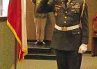 BEE PHOTO / TONI WALKER American Legion Post 351 Honor Guard member Harry Campbell salutes the American Flag as Daingerfield High School student Landon Sears plays Taps in the background to close out the D-LS ISD Veterans Day program. Duty, Honor, Country