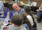 Coach Jeremy Russell speaks with his family shortly after being introduced as Pewitt CISD’s new athletic director during Thursday’s school board meeting. Coach Russell previously served as offensive coordinator at Newton High School. BEE PHOTO / QUINT Pewitt CISD introduces