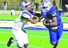 Chase Johnson delivers a stiff arm to a Newton player during Friday’s game. Johnson accounted for four touchdowns during Friday’s game -- two rushing and two passing. BEE PHOTO / QUINTEN BOYD For the city: Daingerfield advances to state semis after 42-21 win over Newton