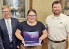 Cydney Carey, center, accepts the Cypress Bank Presidential Scholar laptop from Cypress Bank Vice-President Josh Cato (right). Also pictured is NTCC Honors Director Andrew Yox. COURTESY PHOTO Cypress Bank gives