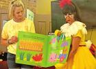 Ms. Maria (right) reads the story of The Little Red Hen to children at the Hughes Springs Library with the help of Valerie Epnett (left). Epnett operates Storybook Daycare in Daingerfield, and brought a group of children to the event. BEE PHOTO / TONI WAL Ms. Maria brings her “Cool School” to Hughes Springs Library