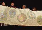 Students hold a banner featuring all five military branches during a program at Daingerfield High School on Veteran’s Day. Veterans were asked to stand as their branch was named. Duty, Honor, Country