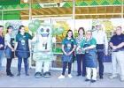 BEE PHOTO / TONI WALKER Lone Star welcomed Dollar Tree to town on June 13. Store manager Shelly Baugh, center, cuts the ribbon on the newly revamped store, which is located in the old Family Dollar location in Lone Shopping Center. With Baugh is Dollar Tr Article Image Alt Text