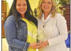 Amie Nix (left), owner of The Painted Petal, accepts the Business of the Year Crystal Globe award from Chamber Vice-President Leigh Stevenson. Hughes Springs honors those who helped make the community “Stronger Together” in 2020