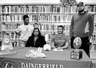 BEE PHOTO / TONI WALKER Jakauri Woods, seated at right, signed a National Letter of Intent to play football at Southern Arkansas University in Magnolia, Ark. on Feb. 13. Woods played quarterback during his career at Daingerfield, leading the 2018 team fou Article Image Alt Text