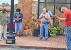 Dr. Edwin Brockway, center, opens the Daingerfield Prayer Walk with prayer on Sept. 26. COURTESY PHOTO Prayer Walk held in Daingerfield
