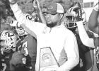 BEE PHOTOS / TONI WALKER Coach Davin Nelson and the Daingerfield Tigers celebrate their Area Championship over Harmony while the Tiger band performs the school song. Article Image Alt Text