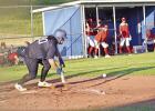 Daingerfield catcher Cayden Simpler lays down a bunt early in action against the Hughes springs Mustangs on April 11. Tigers, Mustangs split two games