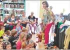 BEE PHOTO / TONI WALKER Storyteller Dru Woods shares with children at the Hughes Springs Area Public Library the magic of puppetry and storytelling as part of the library’s annual summer event schedule. Children were introduced Article Image Alt Text