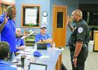 New Daingerfield-Lone Star ISD Police Chief Tracy Robinson is sworn in by school board president Neil Roney while members (from left) Joe Austin II, Randy Terry and Scott Pollan look on. BEE PHOTO / QUINTEN BOYD D-LSISD swears in new police chief, takes steps to cool its schools