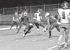 DJ Robinson (21), of the Daingerfield Tigers, prepares to wrap up a Hooks ballcarrier during play on Oct. 29. Daingerfield’s Dee Lewis (1) and Jalin Jones (18) looks on. COURTESY PHOTO Lewis crowned Homecoming King, leads Daingerfield to 56-20 win over Hooks