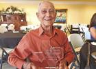 Now-retired Mayor James ( Jim) Samples holds his award with pride at his retirement lunch at The Legacy Center ( Photo by Nicole Kimball ) Hughes Springs comes together as their 91-year-old mayor retires