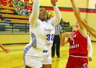 Lady Tiger K. Lee (33) puts up a shot against Harmony last week. Lady Tiger K. Lee (33) puts up a shot against Harmony last week.