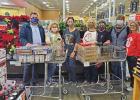 Brookshire’s store director Jeremy Morton, far left, is seen with members of the service sorority Beta Sigma Phi Brenda Morgan, Laurie Laney, Melissa Burke, Janet Littlefield, Beth Goodman, and Chaurhon Gibbs as he presentd them with food donated during Spirit of Christmas food drive benefits local families