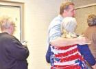 BEE PHOTO / TONI WALKER Doug Reeder is congratulated by his opponent, Deborah MacKay (wearing red, white, and blue), after it was posted that Reeder had won the Morris County Judge election on Nov. 6. Reeder garnered 2,791 votes t Article Image Alt Text