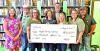 Hughes Springs Library staff receive check from SWEPCO for much needed A/C Unit Courtesy photo